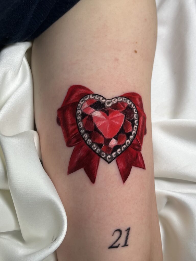 Red chrome tattoo technique used to create a ruby heart jewel