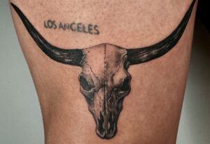 Single needle microrealism tattoo of a longhorn bull skull