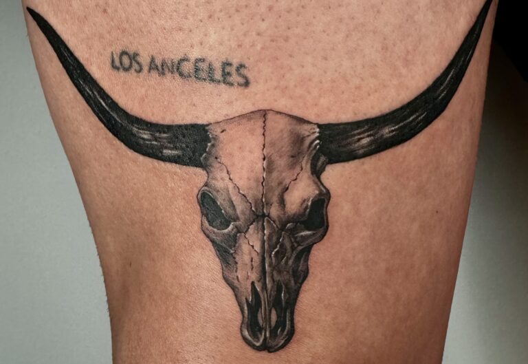 Single needle microrealism tattoo of a longhorn bull skull